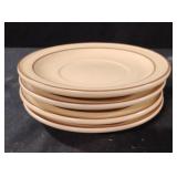 Vintage Pfaltzgraff Village stoneware saucers.