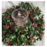 Plastic holly wreath with votive glass