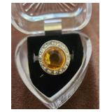 Very nice costume jewelry ring. Topaz color main