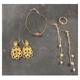 Earrings, bracelet and a ring