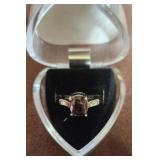 Square cut smoky stone with side clear stones.