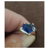 Blue heart stone with simulated diamonds on each
