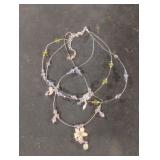 Multi string silver colored necklace