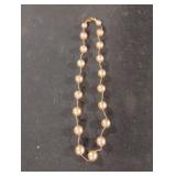 Beaded gold colored necklace