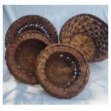 Four vintage  baskets. Three are nesting baskets