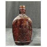 Vintage Log Cabin syrup bottle featuring American