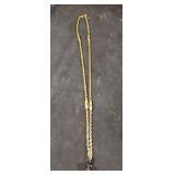 Gold colored bead charm necklace