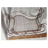 Copper colored metal sleigh