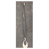 Rope necklace with silver colored charm