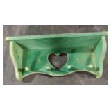 Vintage wood wall shelf featuring a heart cutout