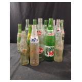 Vintage glass drink bottles including Coca-Cola,