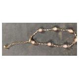 Gold colored and beaded bracelet