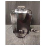 Keurig coffee maker. Powers on