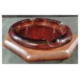 MCM amber glass and wood-base ashtray featuring a
