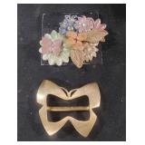 Floral brooch and a butterfly belt buckle