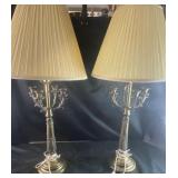 Antique candelabra table lamps features a brass