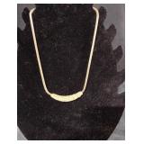 gold-tone snake chain necklace featuring a