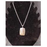Silver colored necklace with rectangular pendant