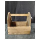 Handmade wooden utility caddy with a bottle