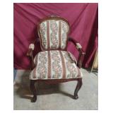 vintage French-style armchair crafted from carved