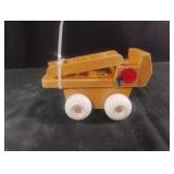 vintage wooden toy vehicle with white plastic