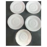 White saucers with gold and silver accents