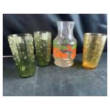 Glass cups and juice pitcher