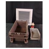 Metal vent, plastic trays and Lubricating Oil. NO