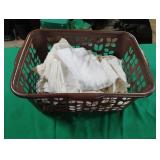 Sheets and pillow cases in a clothes basket