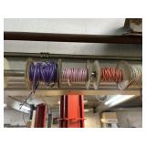 Assorted rolls of wire over door