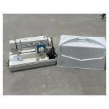 Dressmaker Sewing Machine (powers on)