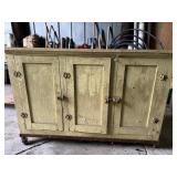 Vintage yellow cabinet on wheels
