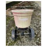 Pull behind fertilizer spreader