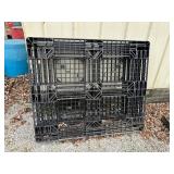 Two plastic pallets