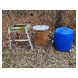 Metal trash can, plastic drum and stand