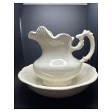 Small ceramic bowl in pitcher