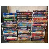 Disney VHS tapes and holder etc.