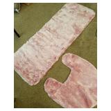 Pink bathroom rugs & gray pillow