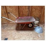 Vintage wheelbarrow, umbrella, stand, tank