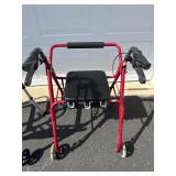 Rolling walker with seat and brakes