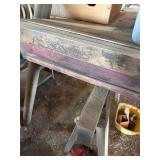 Vintage wooden table top on sawhorses