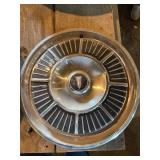 Vintage Plymouth and Pontiac hubcaps