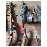 Vintage harness pieces, ice skates, Bowsaw