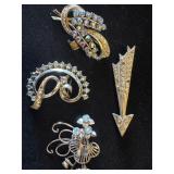 Vintage aurora borealis and rhinestone brooches