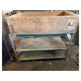 Metal shelf with heavy wooden box