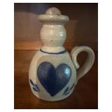 Vintage row, pottery oil lamp