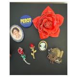 Small wooden jewelry box and vintage brooches