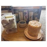 Candles, one in a Roseville crock