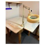 Shop table with attached light, black light
