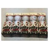 Five new sleeves of golf balls.  Boston Red Sox